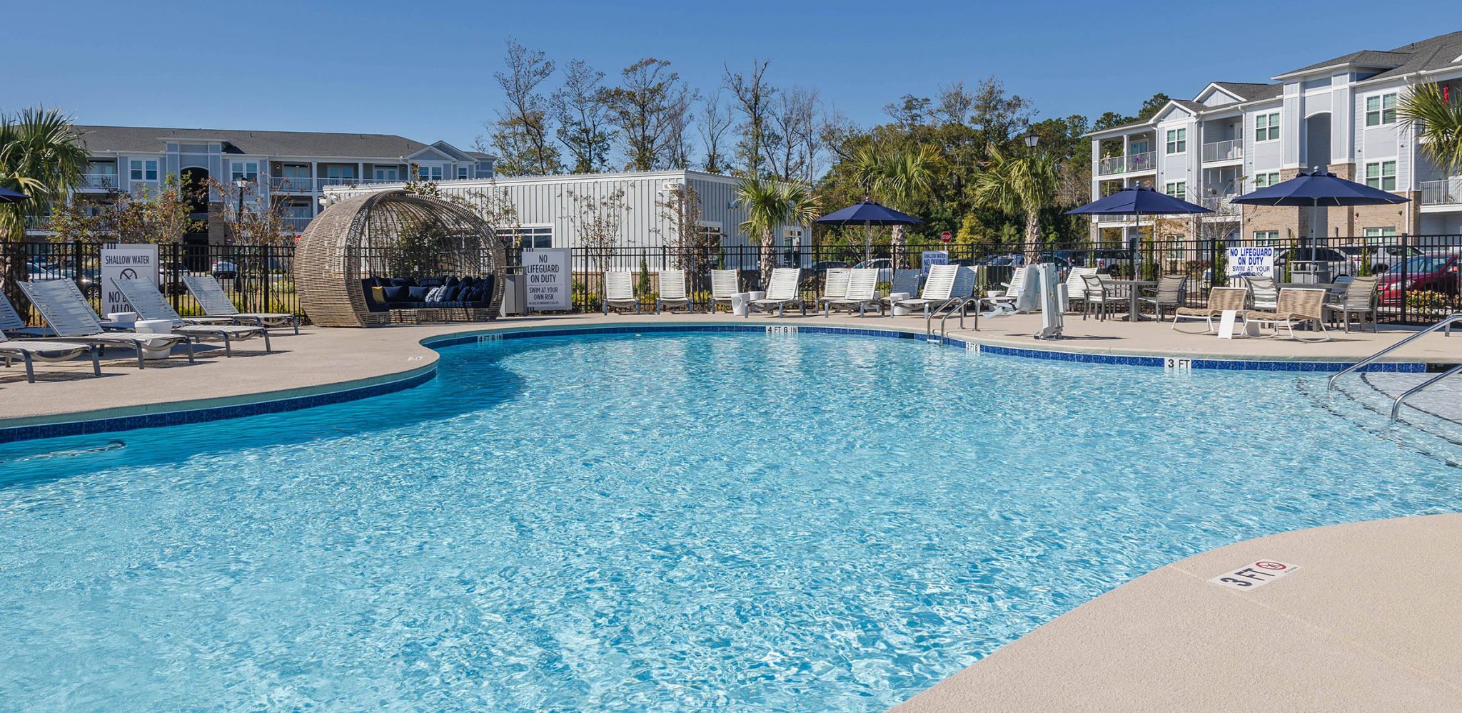Hawthorne Waterway spacious apartment bedroom with hardwood floors and large windows